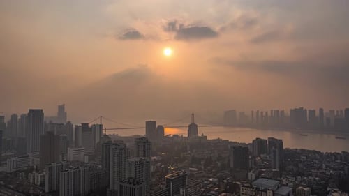 Aerial scenery of modern city skyline, commercial office buildings in financial district at sunrise