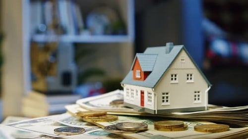 Property Savings Idea Mini House On Money Stack Indoors