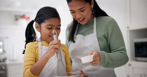 Mother and Child Mixing Batter at Home