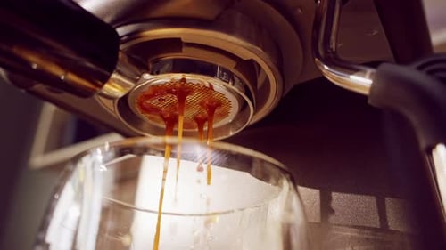 Slow Motion Extreme Close Up Of Espresso Pour Exploding From Bottomless Portafilter With Chaotic