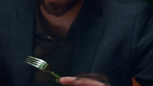 Handsome businessman enjoying salad meal at luxury restaurant on romantic date night