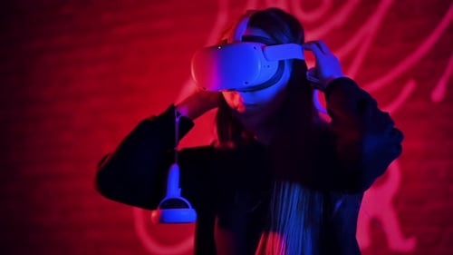 Girl Wearing Virtual Reality Headset at Night