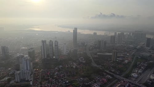 Aerial View of Sunrise Over Hazy Cityscape