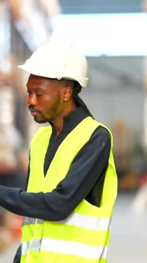 Warehouse Worker Scanning Inventory with Barcode Scanner