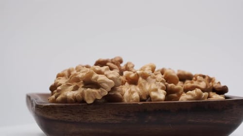 Walnut Halves in Rustic Wooden Bowl