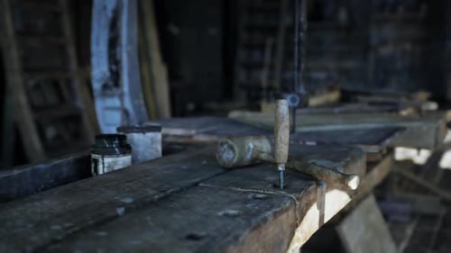 Old Carpentry Workshop Filled with Vintage Tools and Aged Wooden Surfaces