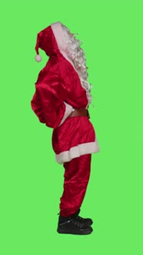 Vertical Video Profile of Santa Suffers From Back Pain in Studio