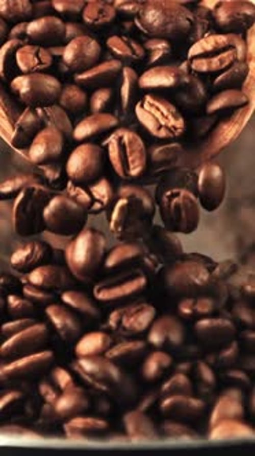 Super Slow Motion From the Wooden Scoop Falling Coffee Beans