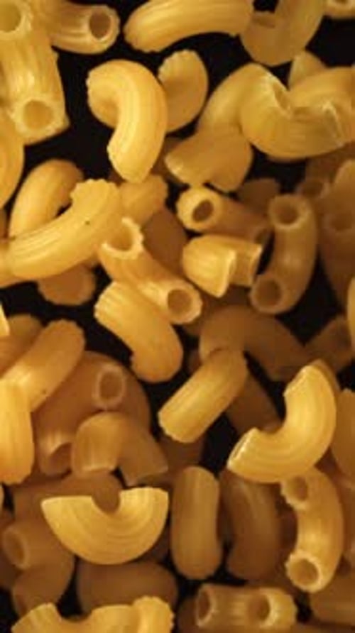 Super Slow Motion Flying Dry Macaroni Pasta Filmed on a Highspeed Camera at 1000 Fps