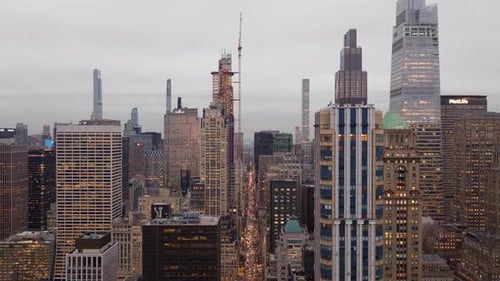 Warm Golden Sunlight Casting Glow Across Midtown Manhattan Skyline Revealing Towering Skyscrapers
