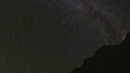 Stars Glittering Above Mountain Peak