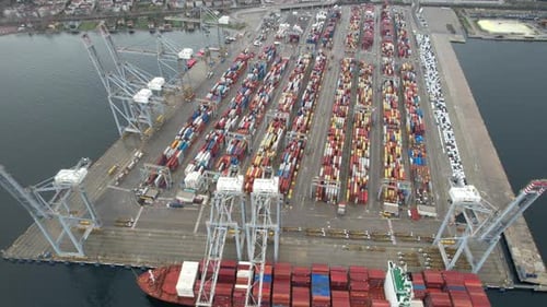Aerial View of Busy Shipping Port with Containers