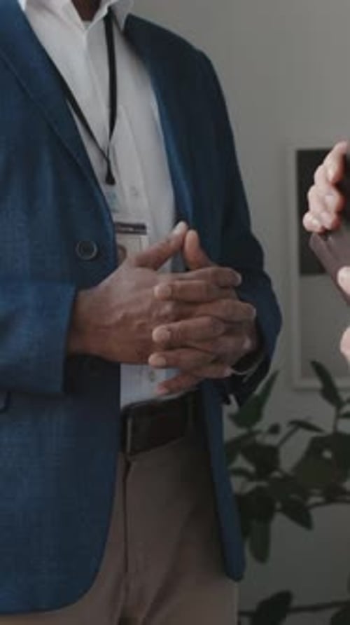 Diverse Male Hospital Executive and Doctor Shaking Hands