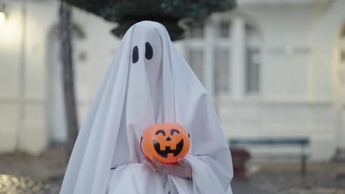 Ghost Holding Jack O'Lantern in Town Square