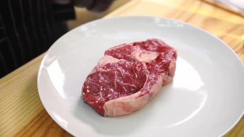 the chef prepares delicious meat in the restaurant