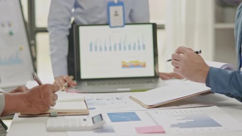 Close up of business hands are working and brainstorming on paperworks.