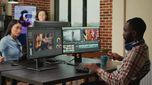 Team Collaborates Editing Video in Modern Office