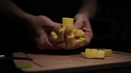 Close Up of Mango Being Cut into Cubes