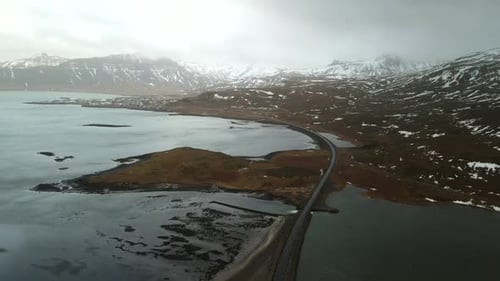 4k drone footage captures the unique beauty of a lake and rocky mountain in Iceland amidst challengi