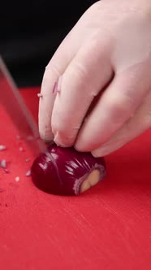 Cutting Fresh Red Onion with Sharp Knife