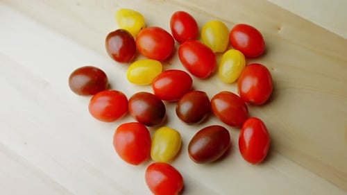 Colorful Cherry Tomatoes on Wooden Background