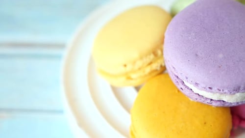 Close Up of Macaroon on Blue Background with Copy Space