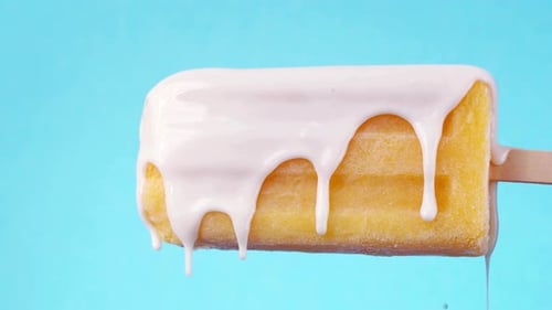 Delicious Popsicle with White Glaze Drizzling Down