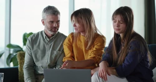 Young Daughter Showing Photograph of Her Boyfriend to Parents Getting Confused with Their Reaction