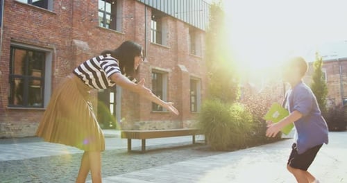 Attaractive mother woman meets child son after school lessons education. Happy little boy schoolboy