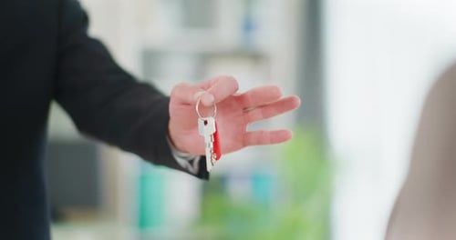 Real Estate Agent Finalizes Sale By Handing Over Keys