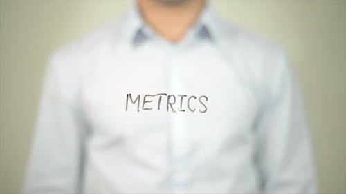 Metrics, Man Writing on Transparent Screen