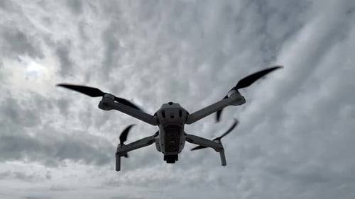 Drone or Copter on the Background of the Sky Bottom Up View Modern Technologies for Shooting Photos