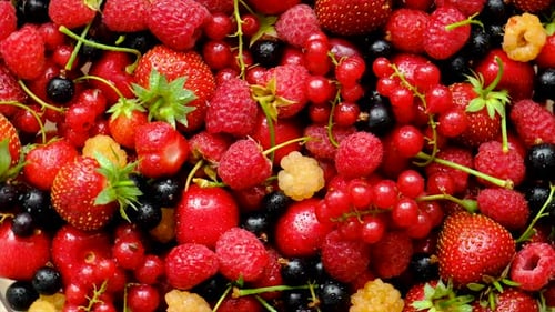 Variety of Fresh Berries Rotating in Close Up