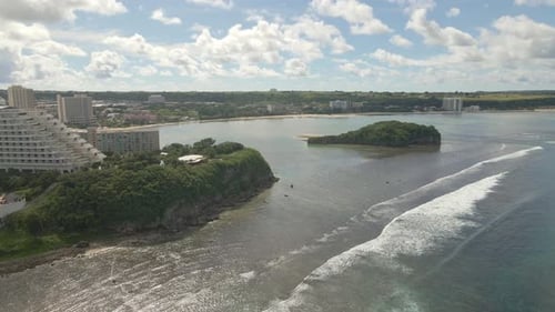 Drone panning over Oka Point and the resorts on Guam Island