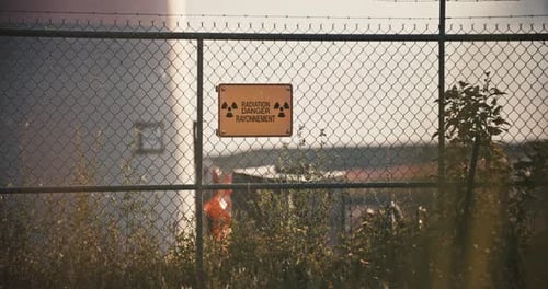 Radiation Warning Sign on Chain-Link Fence