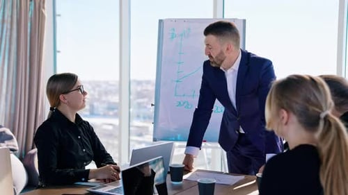 Business Team Discussing Strategy in Bright Conference Room
