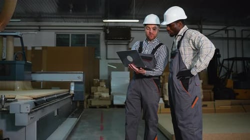 Engineers Oversee MDF Panel Cutting Process