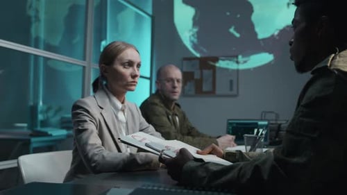 Government Officials Reviewing Classified Documents in War Room