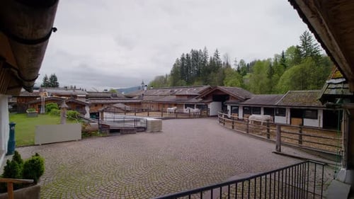 Riding farm hall and horse stable view from the balcony.
