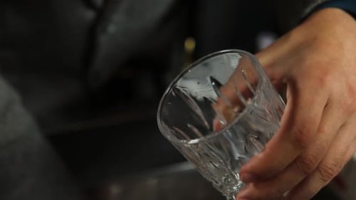 the bartender prepares a cocktail at the bar