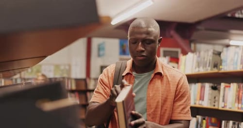 Black man, book and student in library to search at university, college