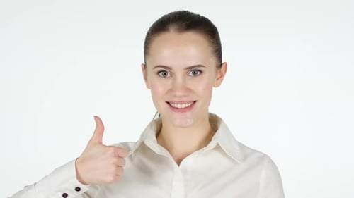 Woman Smiling and Giving a Thumbs Up
