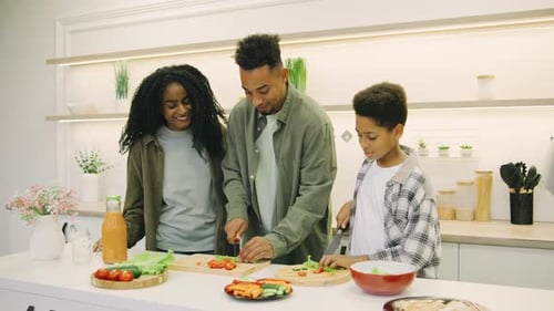 Happy Family Preparing Food in Modern Kitchen