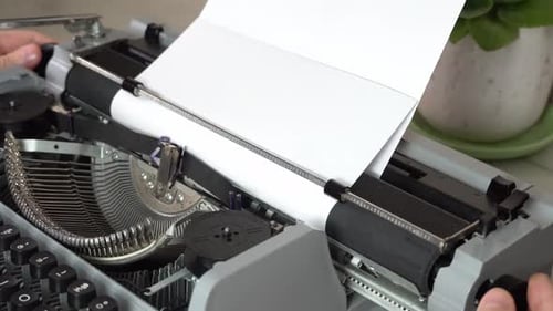 Writing a book and typing old typewriter, top view. Man typing on old vintage retro typewriter