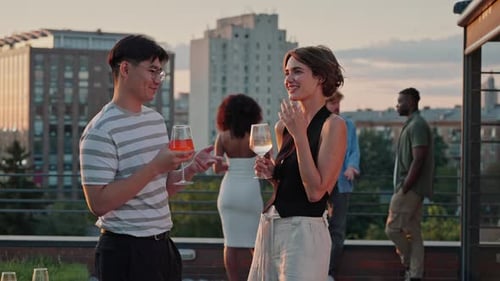 Carefree Friends Toasting Glasses with Drinks During Party
