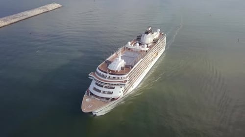 Large cruise ship at sea - Aerial footage at sunrise.
