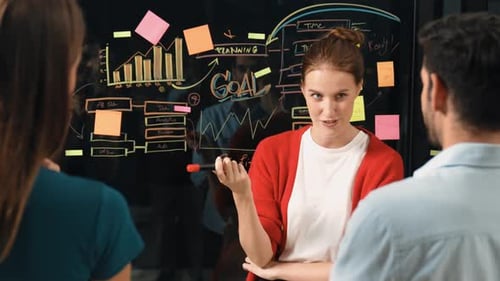 Creative Team Collaborating on a Project at Workplace