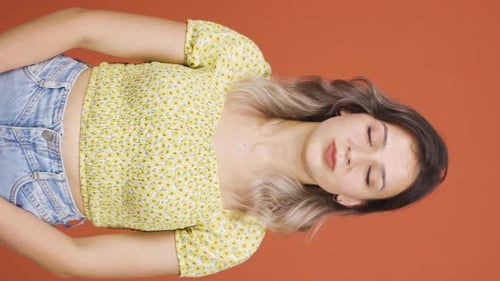 Young Woman Posing with Arms Crossed