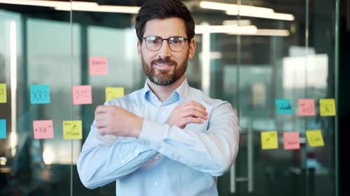Successful Businessman Smiling in Modern Office