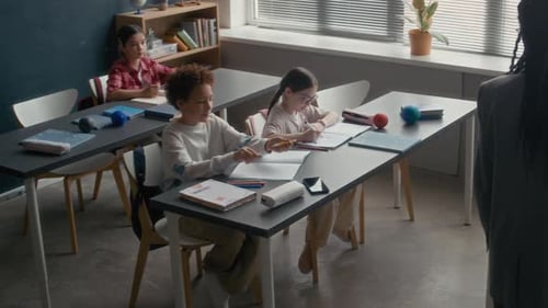 Diverse Students Learning in a Classroom with Teacher